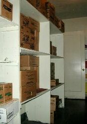Shelves in the supply room.  The door leads to the hallway.