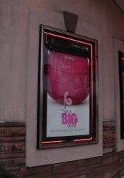 A poster for 'Piglet's Big Movie' in a poster case at the Villa Theatre