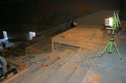 Construction begins on a platform across three rows at the back of the Villa Theatre's stadium seating section