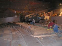 Workman begin leveling the lower seating section of the Villa Theatre