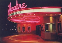 The theater entrance by night.
